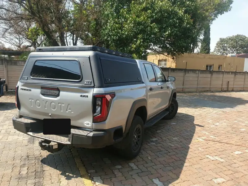 Rear three-quarter view of the canopy showing the tinted glass rear door